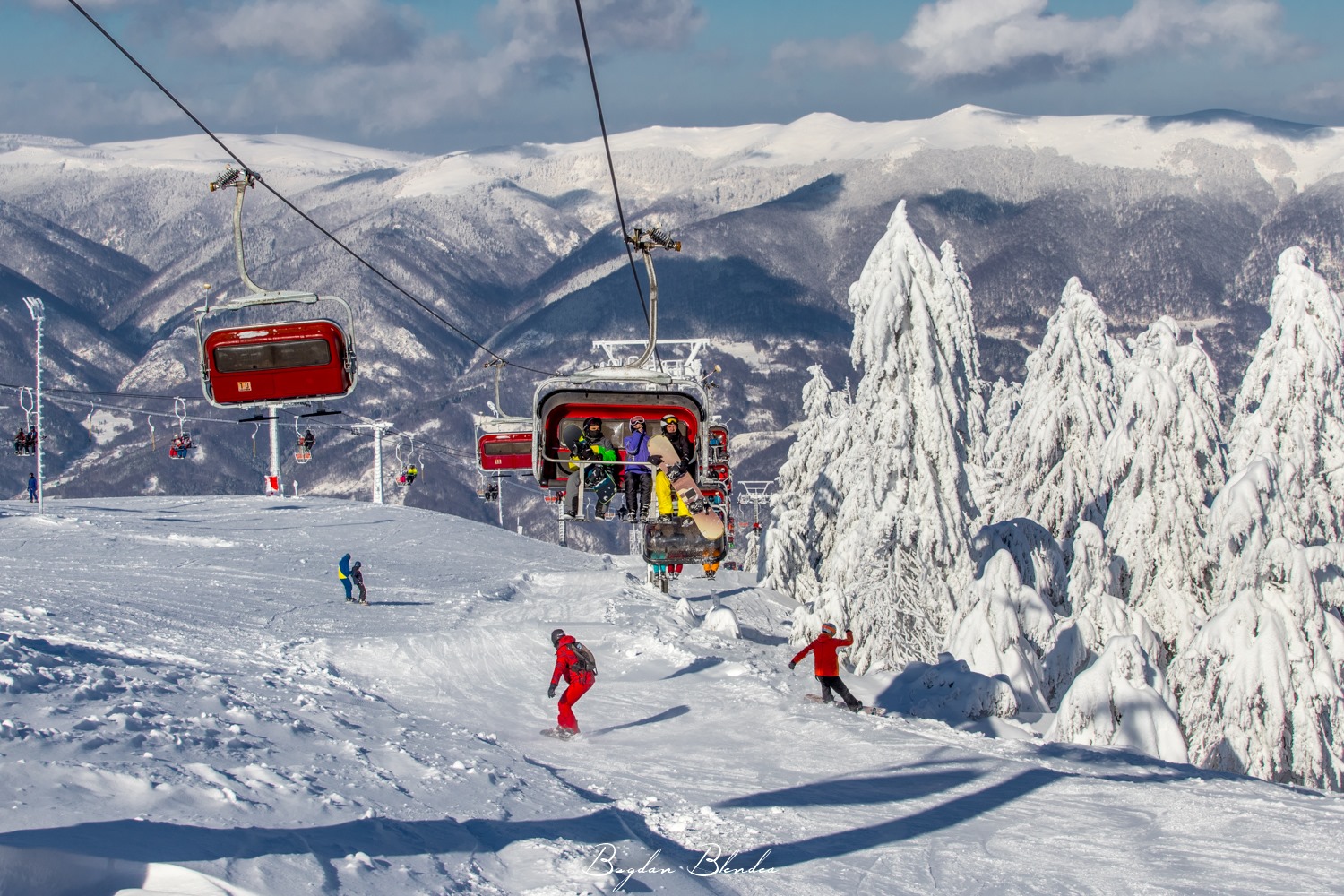 Buscat Ski & Summer Resort in Romania - snow covered mountains in the background.