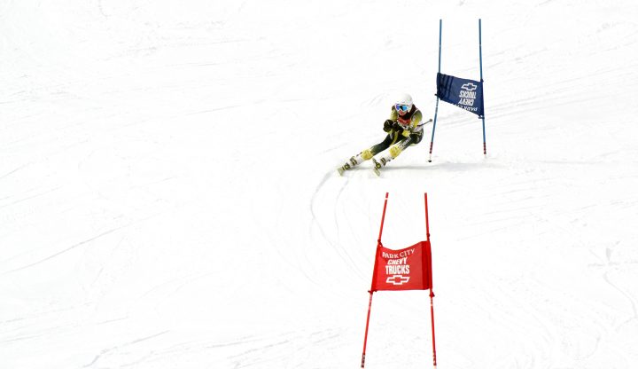 Shanty Creek Summit Mountain in USA - a skier skiing down a slope in the snow.