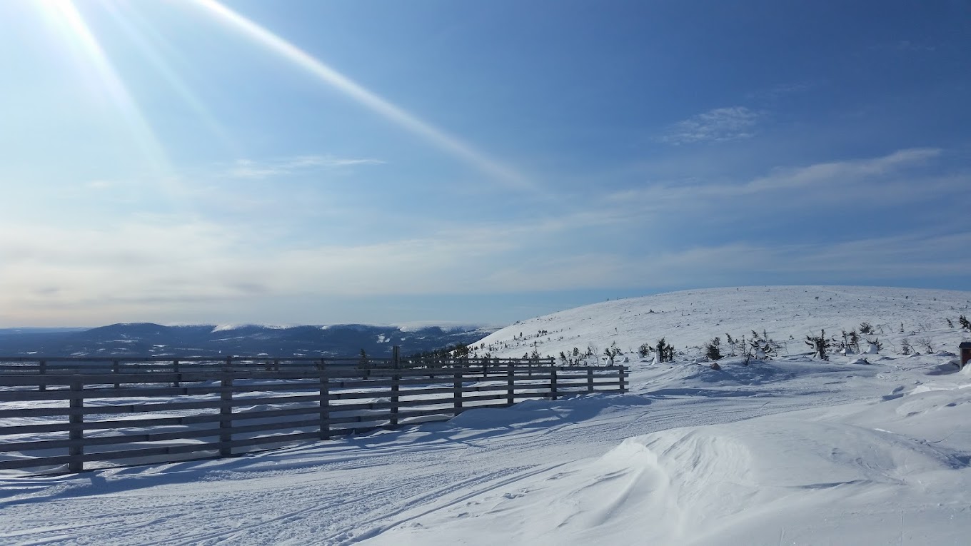 Näsfjället in Sweden - the sun is shining over the snow covered mountains.