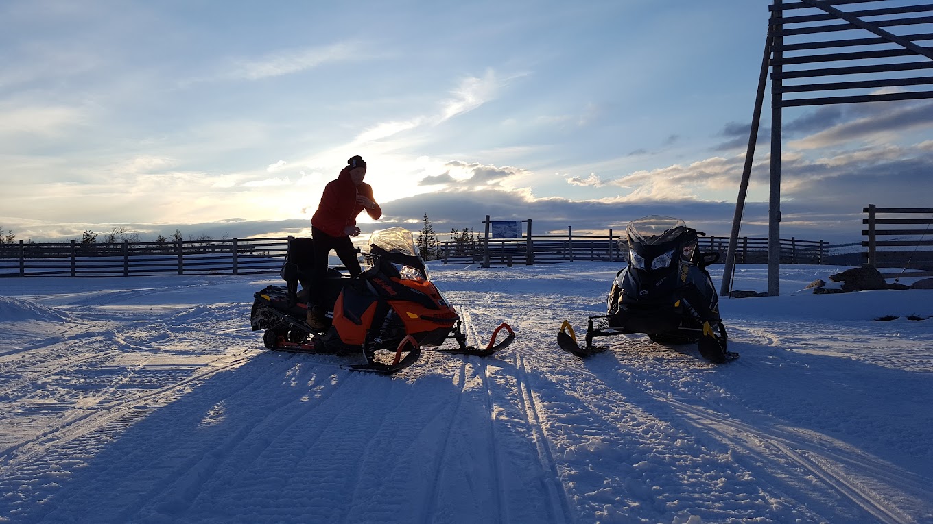 Näsfjället in Sweden - a person on a snowmobile in the snow.