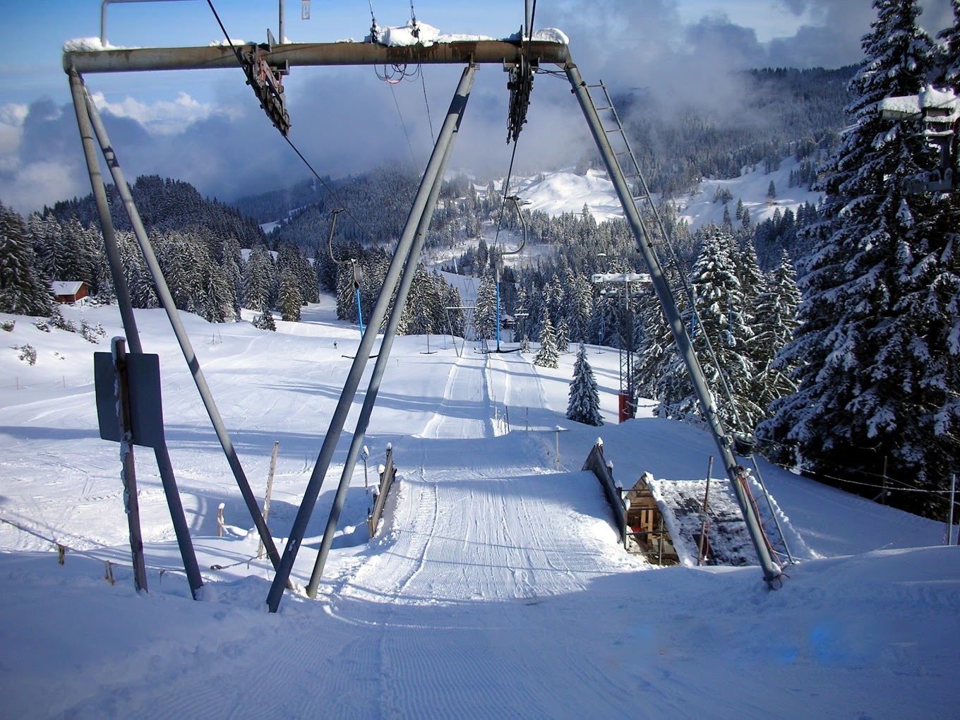 Selital in Switzerland - a ski lift going up a snowy hill.