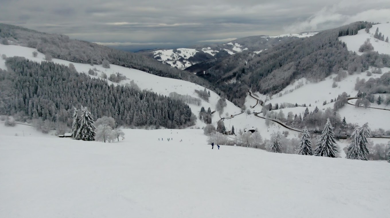 Münstertal-Wieden in Germany - a view from the top of a snowy mountain.