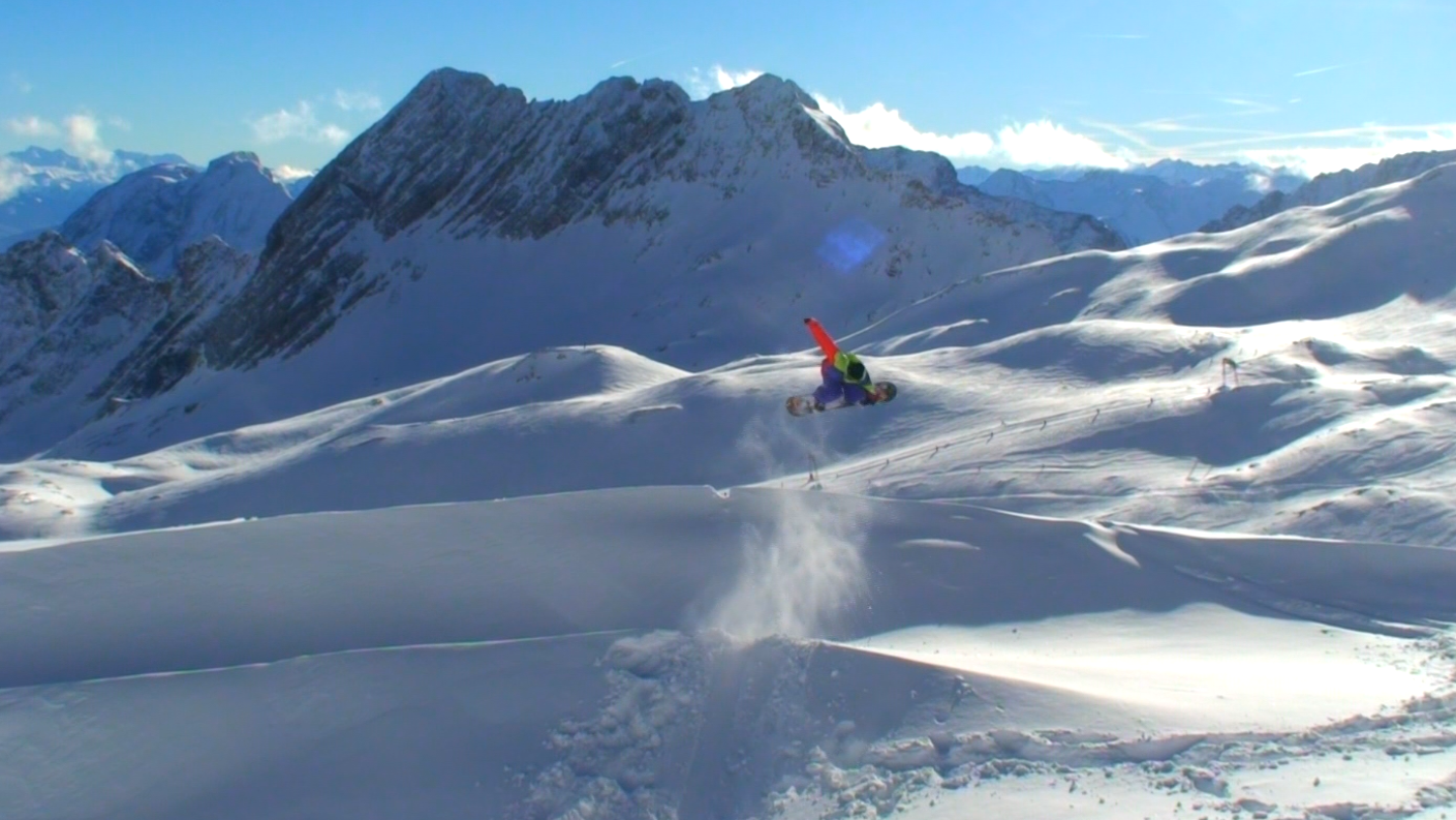 Münstertal-Wieden in Germany - a person on a snowboard in the mountains.