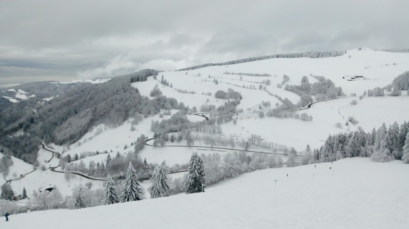 Münstertal-Wieden in Germany - the view from the top of a snowy mountain.