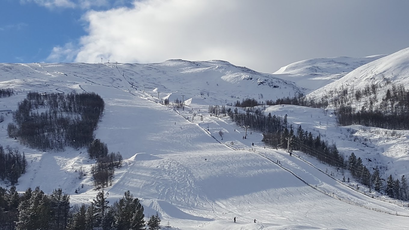 Lemonsjø Alpinsenter in Norway - a snow covered mountain with a ski lift going up it.