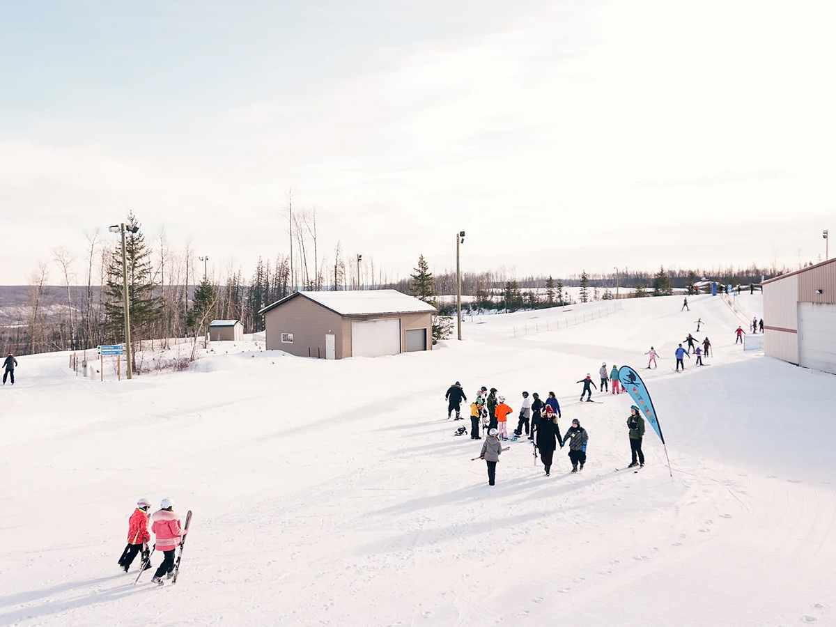 Vista Ridge in Canada - a group of people skiing down a slope.