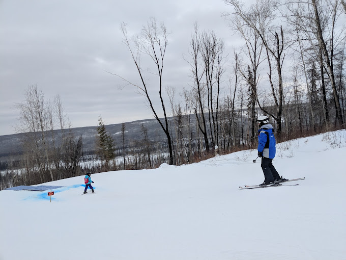 Vista Ridge in Canada - a person on a snowboard in the snow.