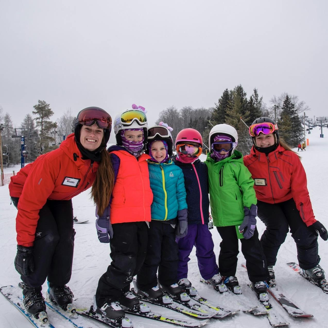 Chicopee in Canada - a group of people posing for a picture in the snow.