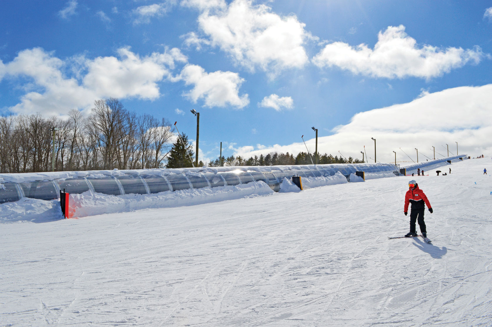 Chicopee in Canada - a person on a snowboard going down a hill.