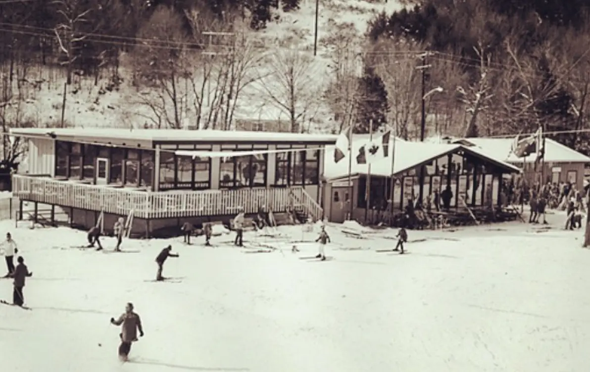 Holiday Mountain -NY in USA - a black and white photo of people playing in the snow.