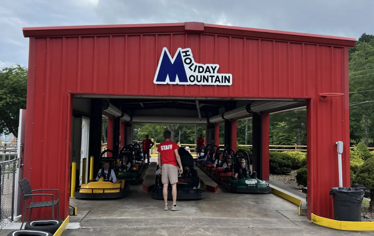Holiday Mountain -NY in USA: a man standing in front of a red building.