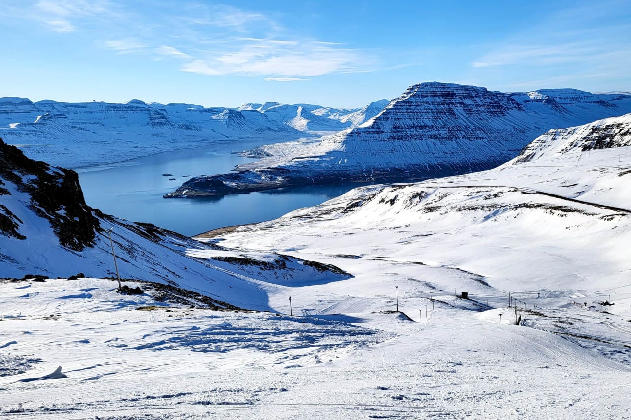 Oddsskarð in Iceland - a view from the top of a snowy mountain.