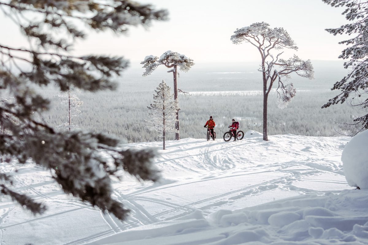 Pyhä in Finland - a person riding a bike in the snow.