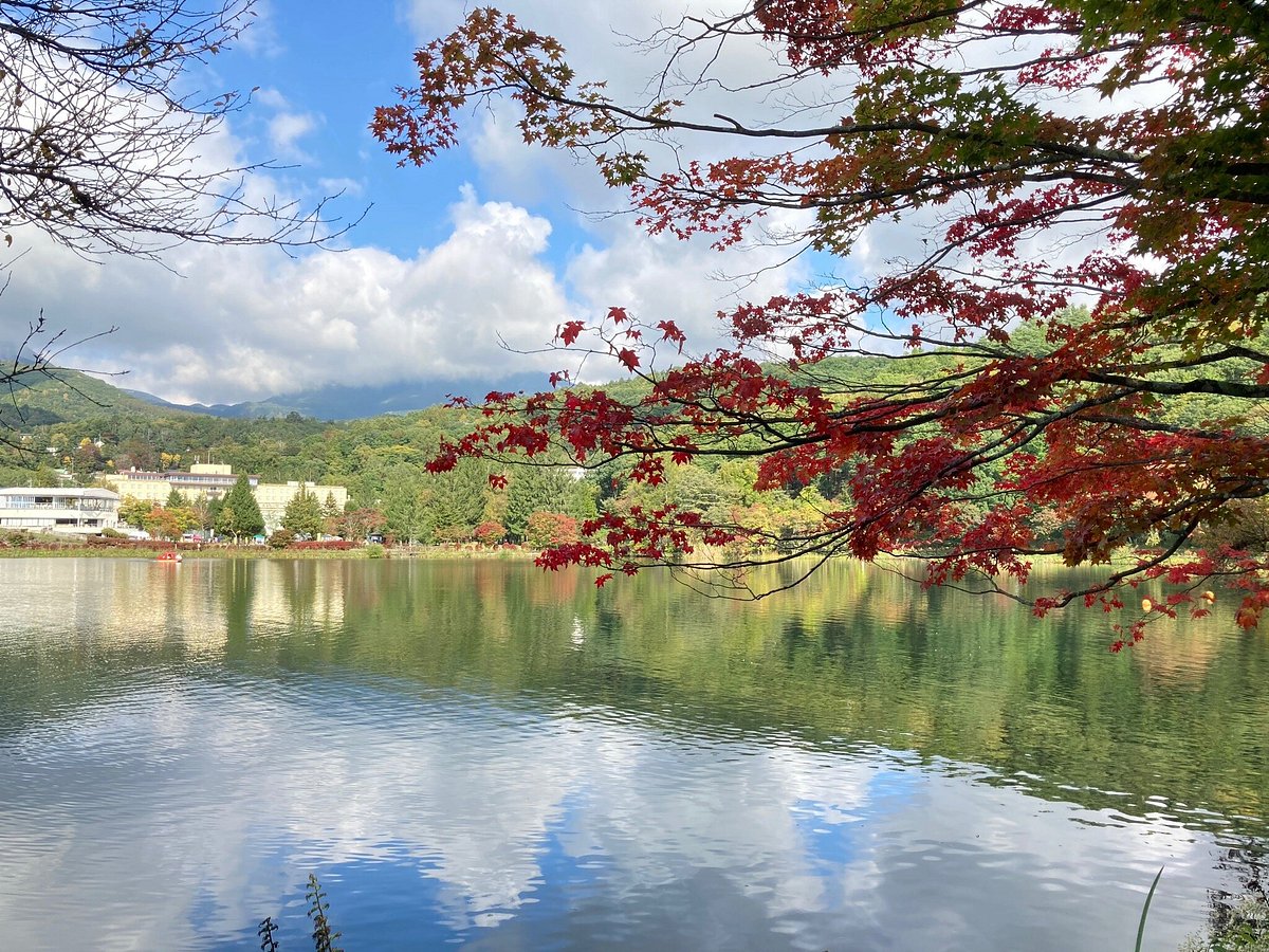 Pilatus Tateshina in Japan - a body of water with trees in the background.