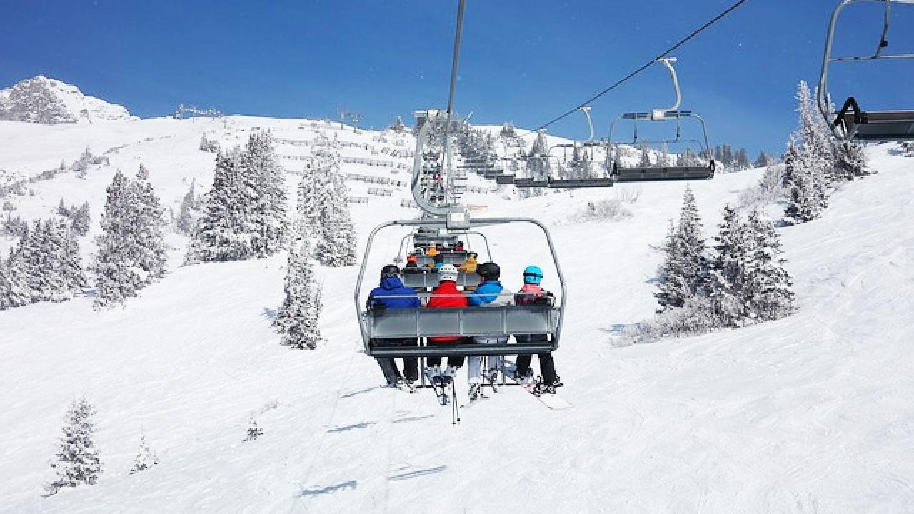 Isafjördur in Iceland - a group of people riding a ski lift in the snow.