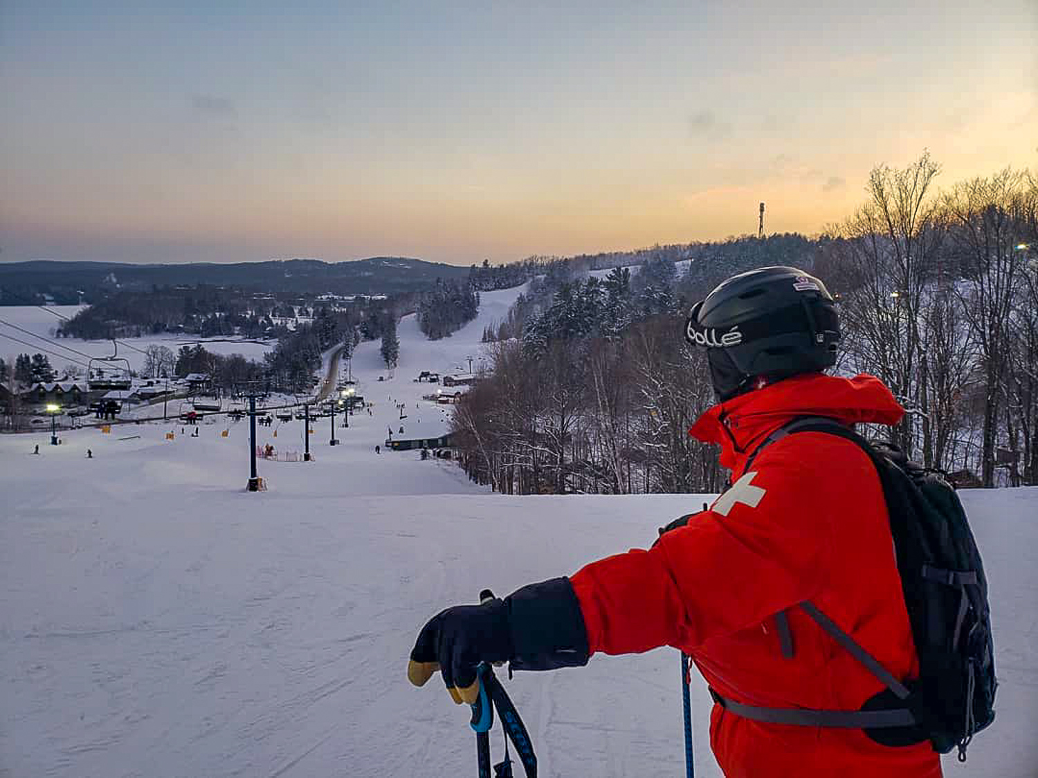 Hidden Valley Highlands in Canada - a person in a red jacket skiing down a hill.