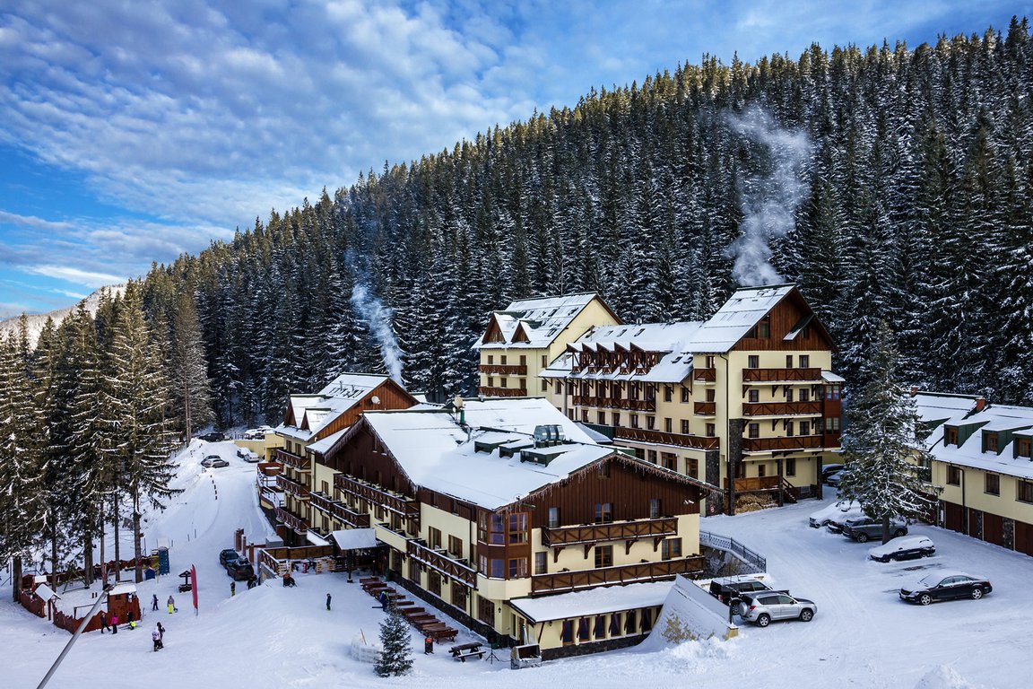 Jasná Nízke Tatry – Chopok in Slovakia: a ski resort surrounded by snow covered trees.