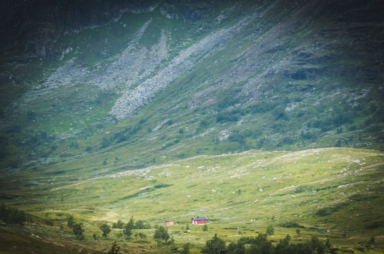 Klimpfjäll in Sweden - a small house in the middle of a mountain valley.