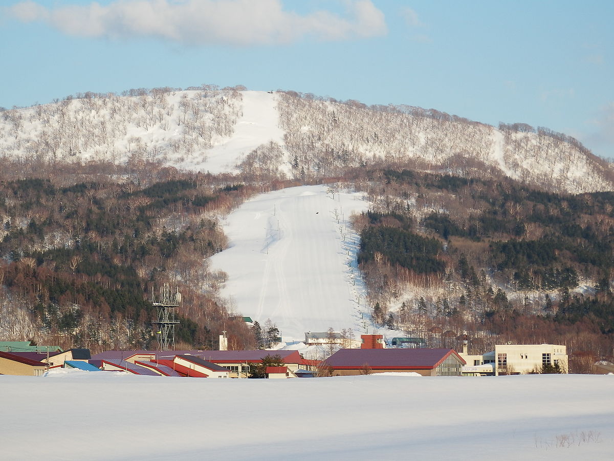 Minami Furano in Japan - a snow covered mountain with a ski lift in the background.