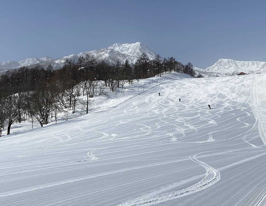 Kamui Misaka in Japan - a person skiing down a snow covered hill.