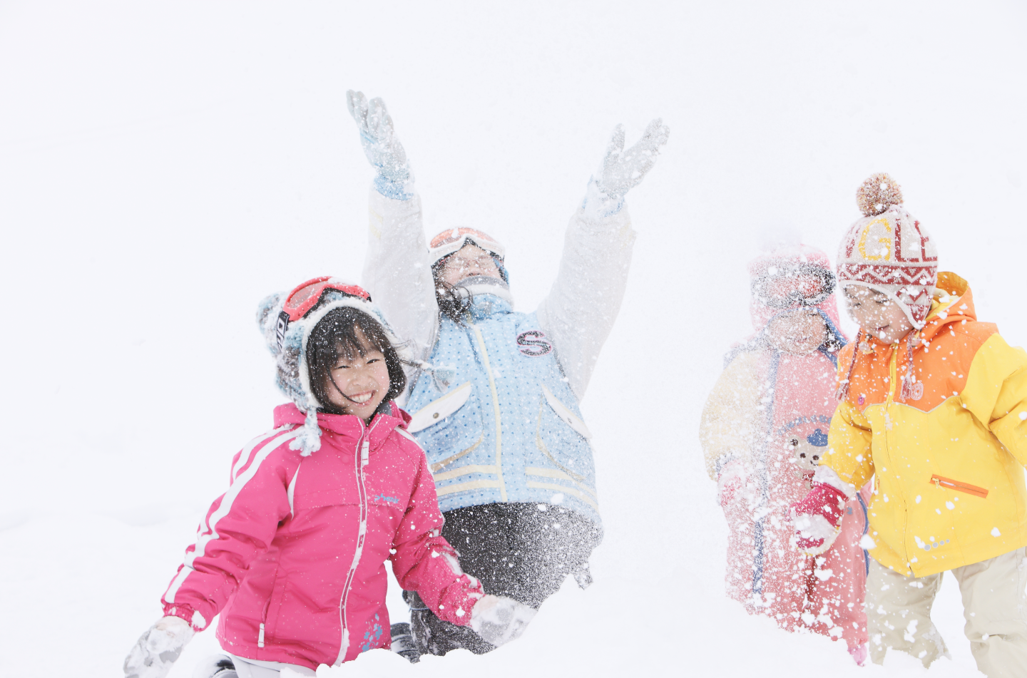 Amihari Onsen in Japan - a group of kids playing in the snow.
