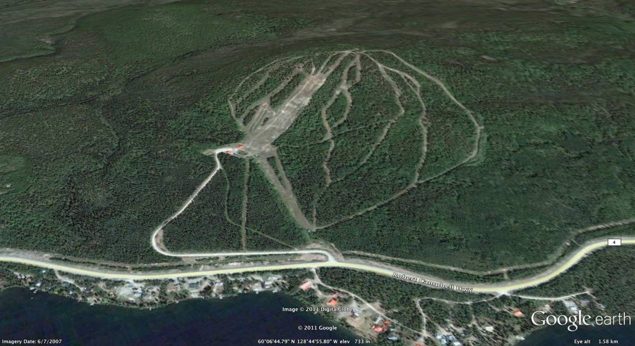 Mt. Maichen Ski Hill in Canada - an aerial view of a road in the middle of the island.