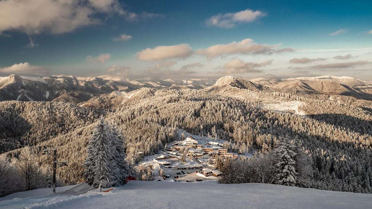 Šachtičky in Slovakia - a snow covered mountain with trees and mountains in the background.