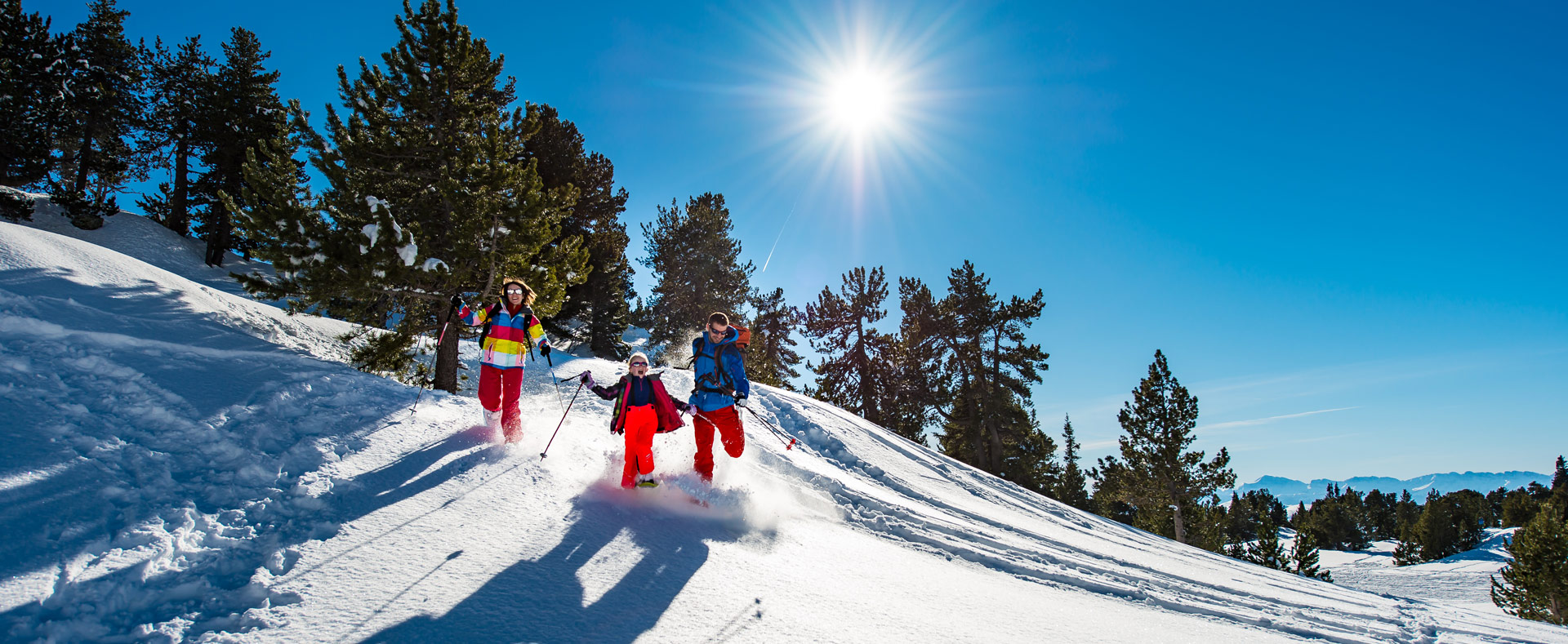 Saint Hilaire du Touvet in France - a group of people skiing down a snowy slope.
