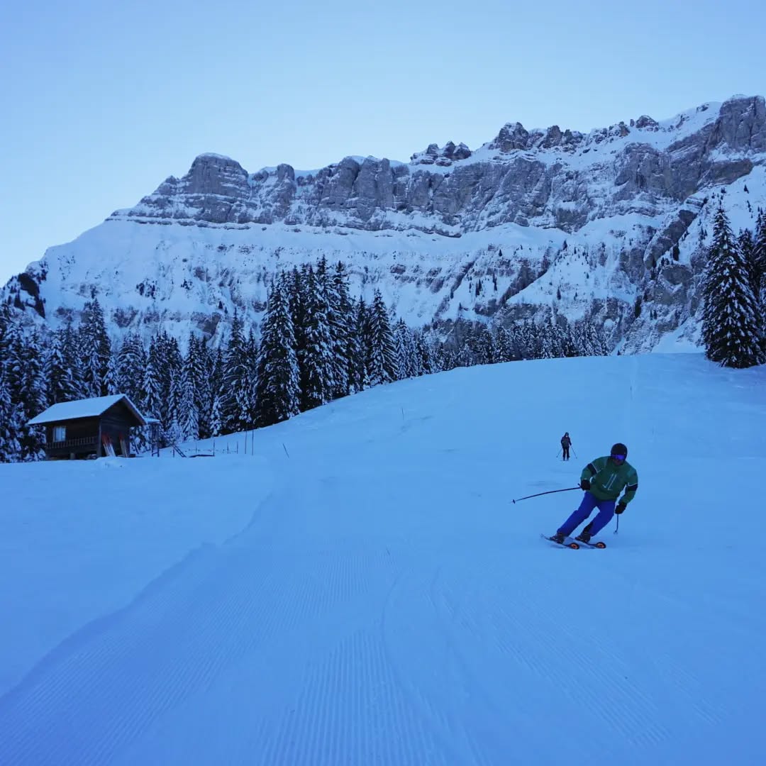 Bumbach in Switzerland - a person skiing down a snow covered mountain.