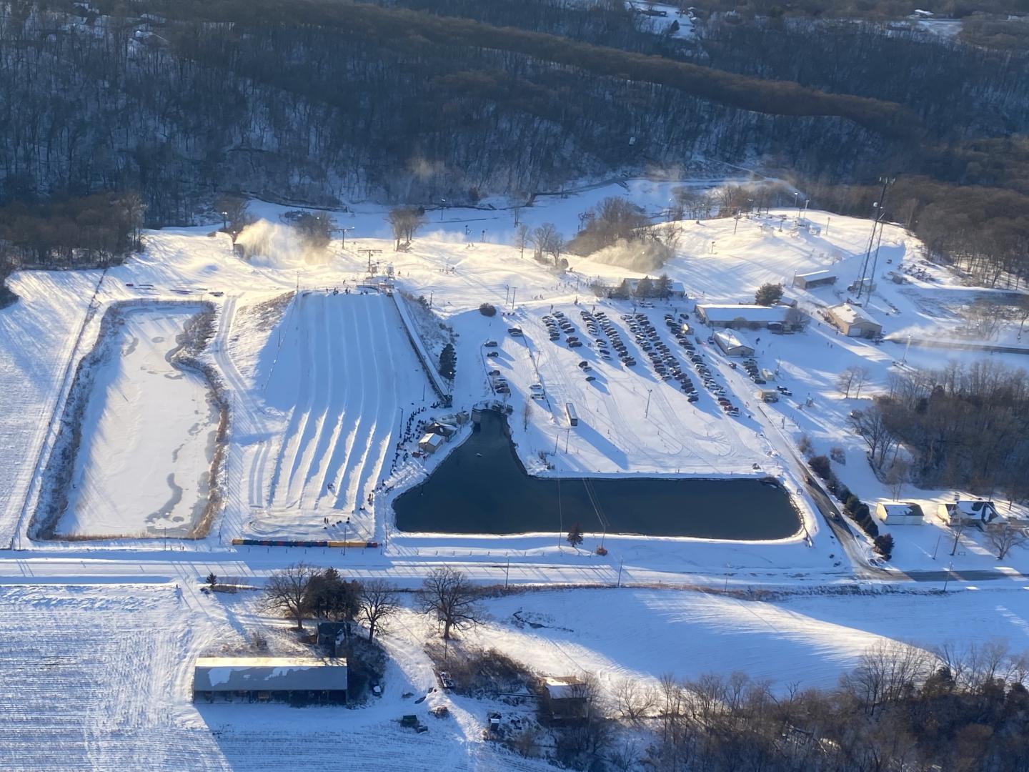 Snowstar in USA - an aerial view of a farm in the snow.