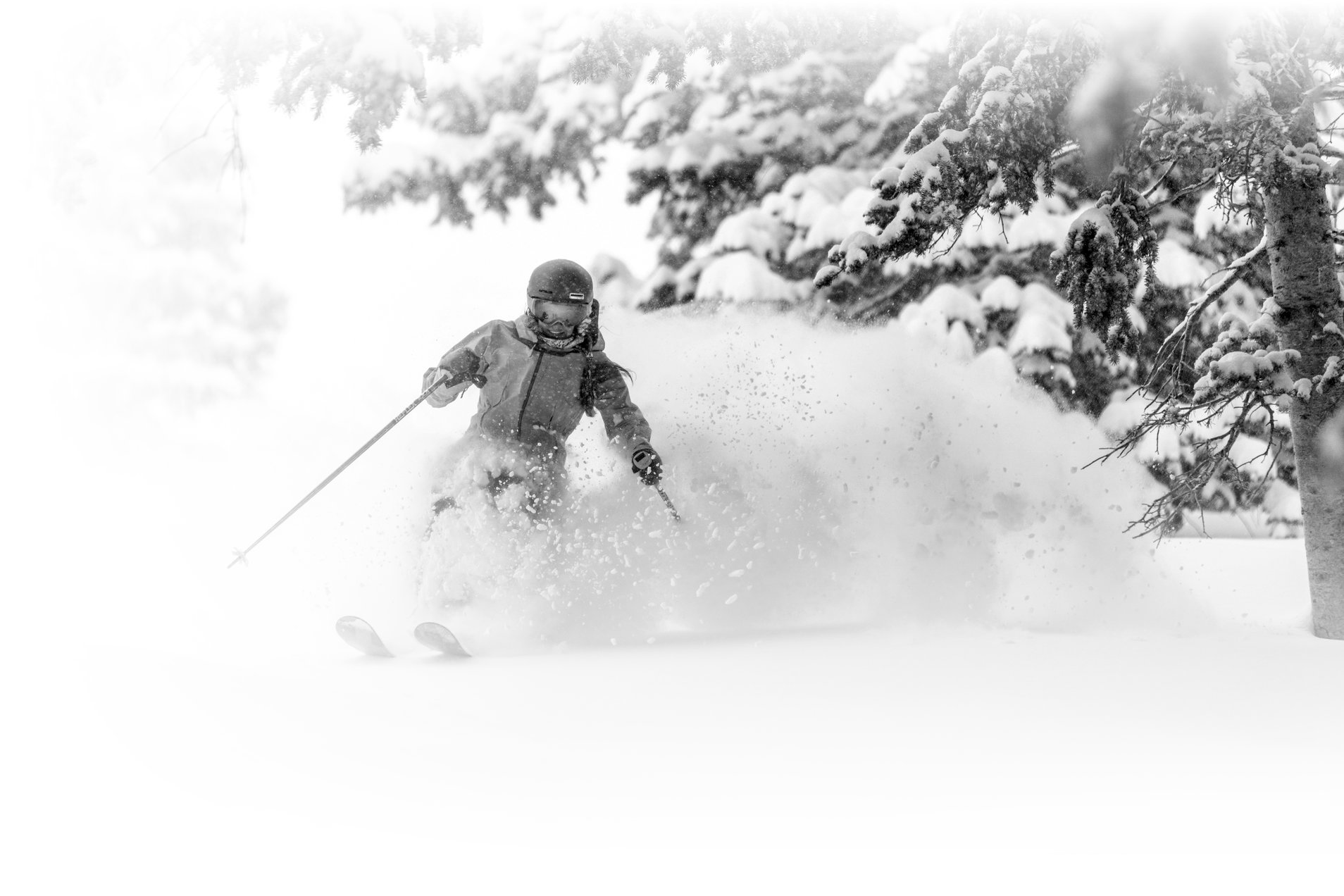Alta in USA - a person skiing down a snow covered hill.