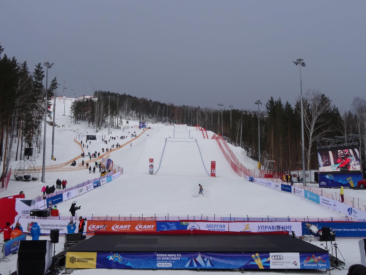Sunny Valley Resort in Ural Federal District - a group of people riding ski boards down a slope.