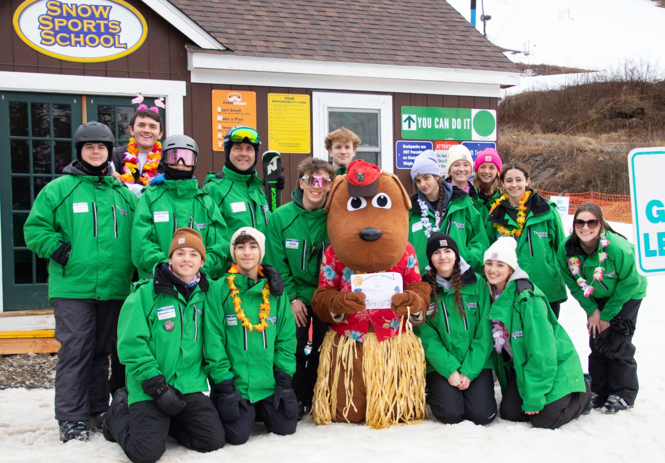 Thunder Ridge in USA - a group of people posing for a picture in the snow.