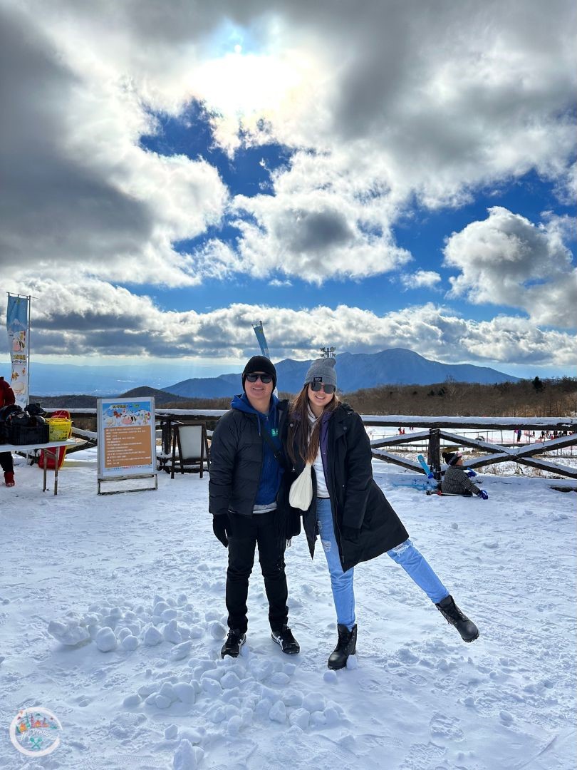 Yeti Resort in Japan - two people posing for a photo in the snow.