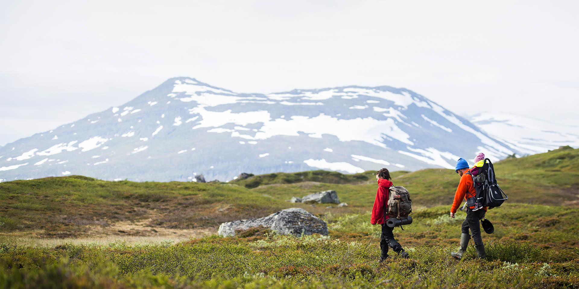 Jäckvik in Sweden - a man and a woman are hiking in the mountains.