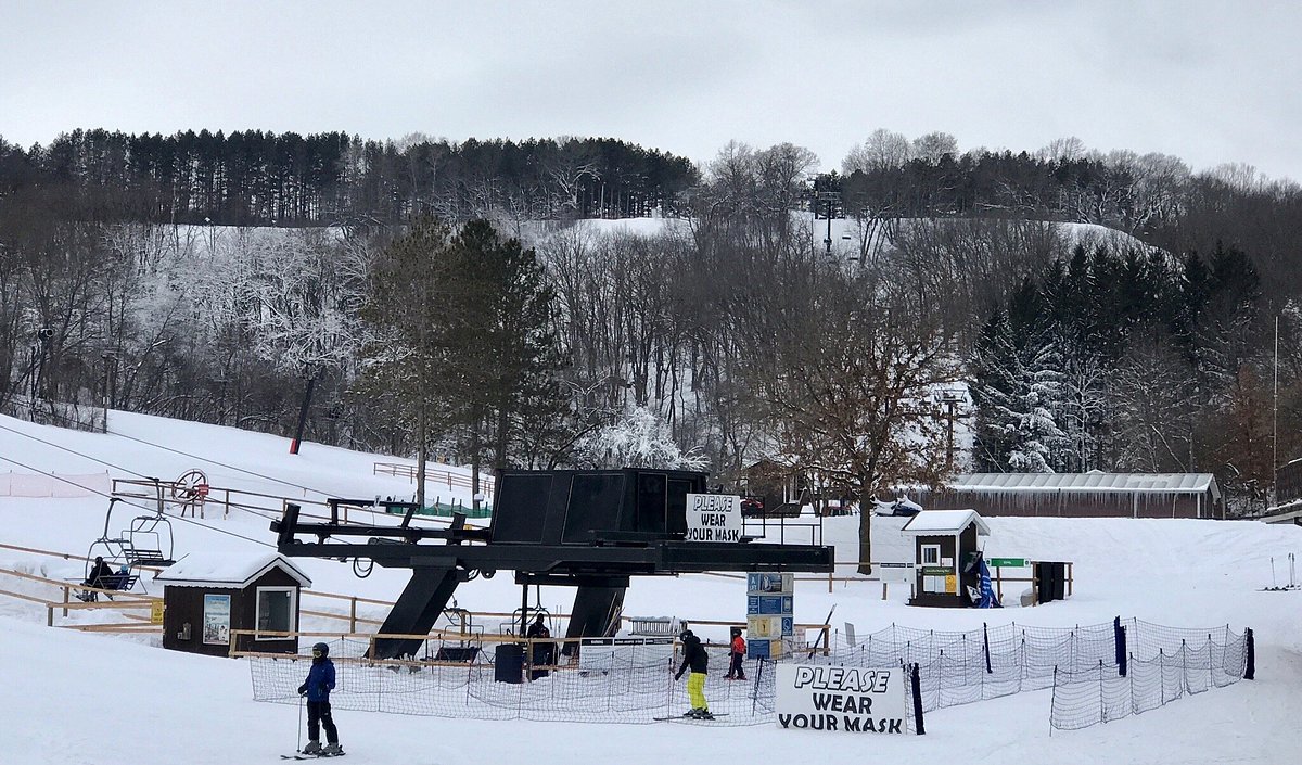 Tyrol Basin – Mt Horeb in USA - a group of people are skiing on a snowy slope.