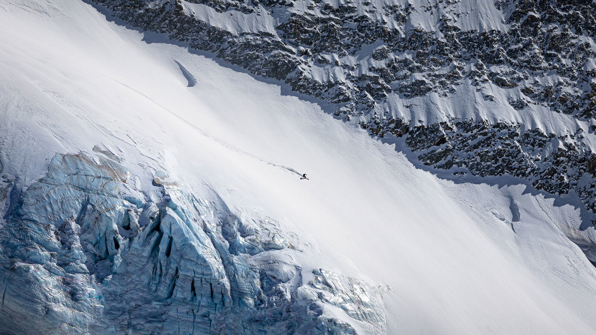 La Grave , La Meije in France - a man climbing up the side of a mountain.
