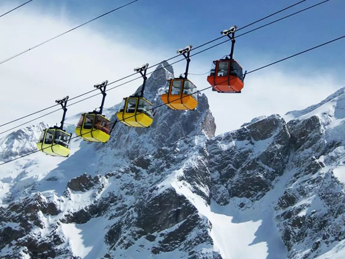 La Grave , La Meije in France - a ski lift going up a snowy mountain.