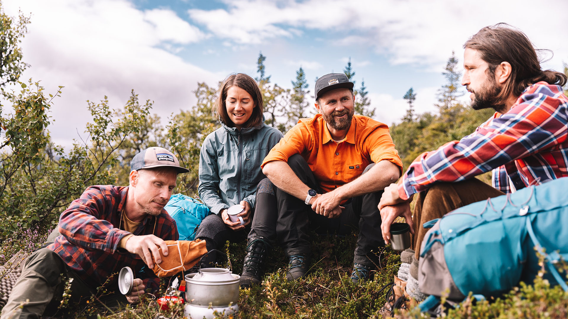 Edsåsdalen in Sweden - a group of people sitting in a field.