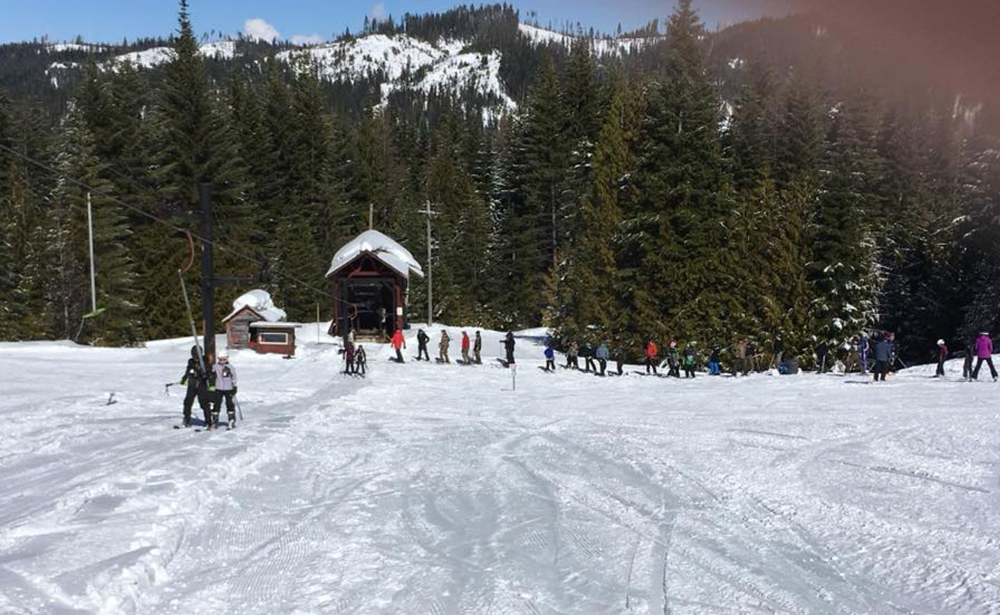 Bald Mountain in USA - a group of people skiing down a snowy slope.