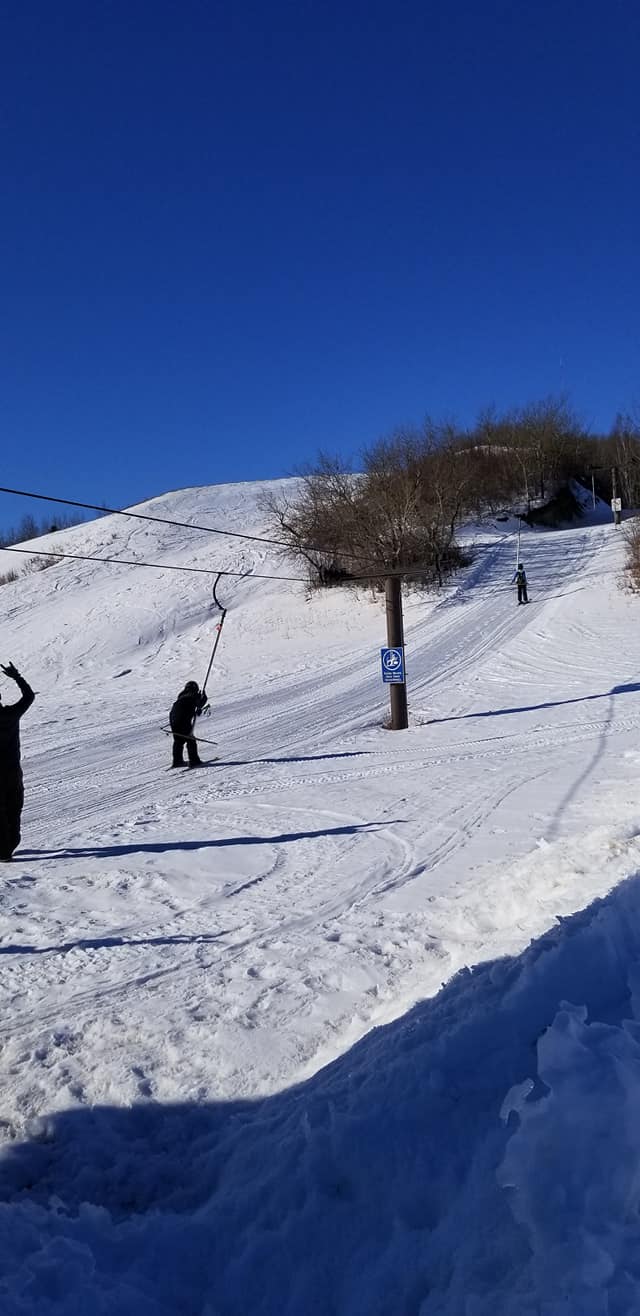 Mount Joy in Canada - a group of people skiing down a snow covered hill.