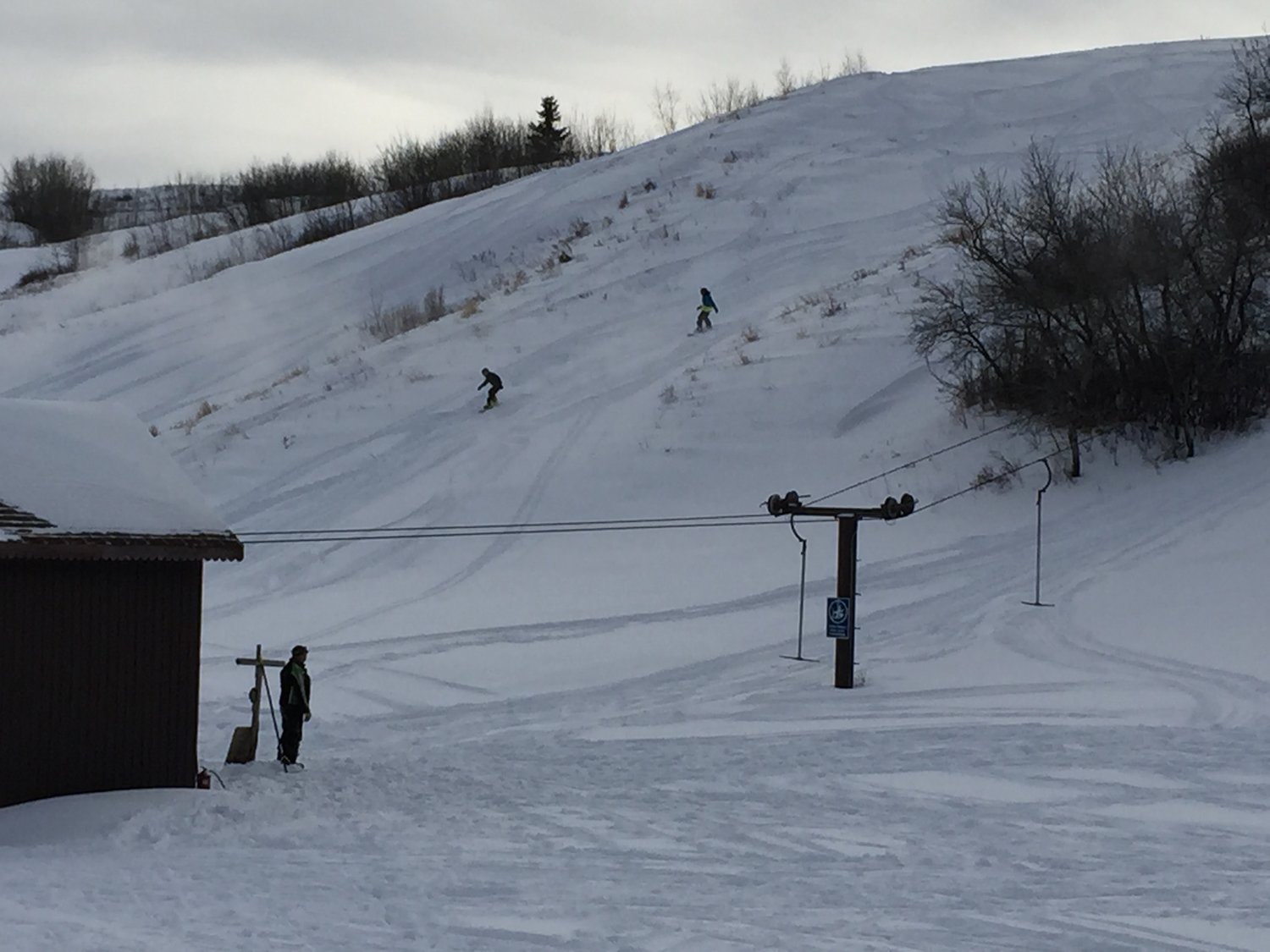 Mount Joy in Canada - a group of people skiing down a snowy hill.