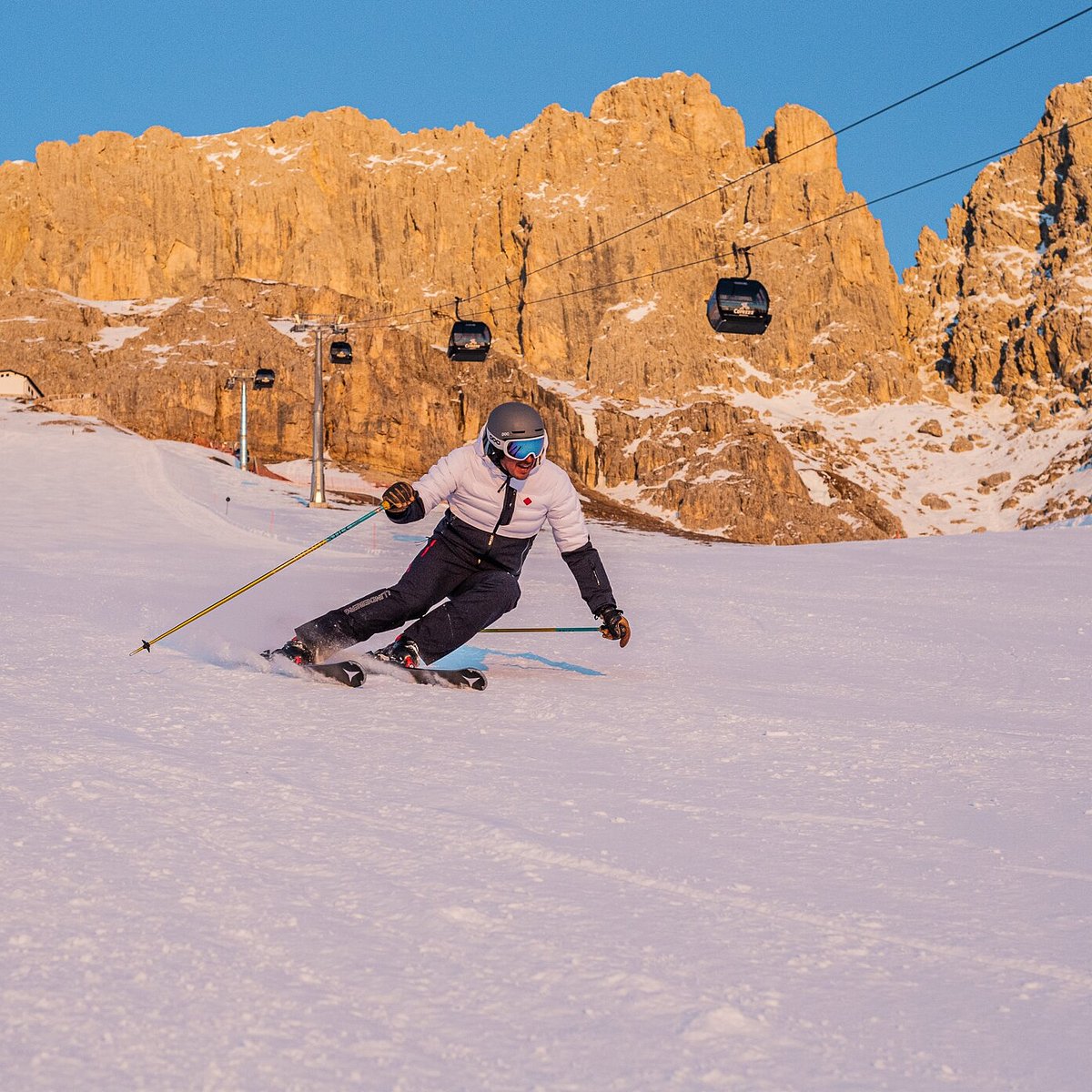 Carezza Dolomites in Italy - a person on skis going down a hill.