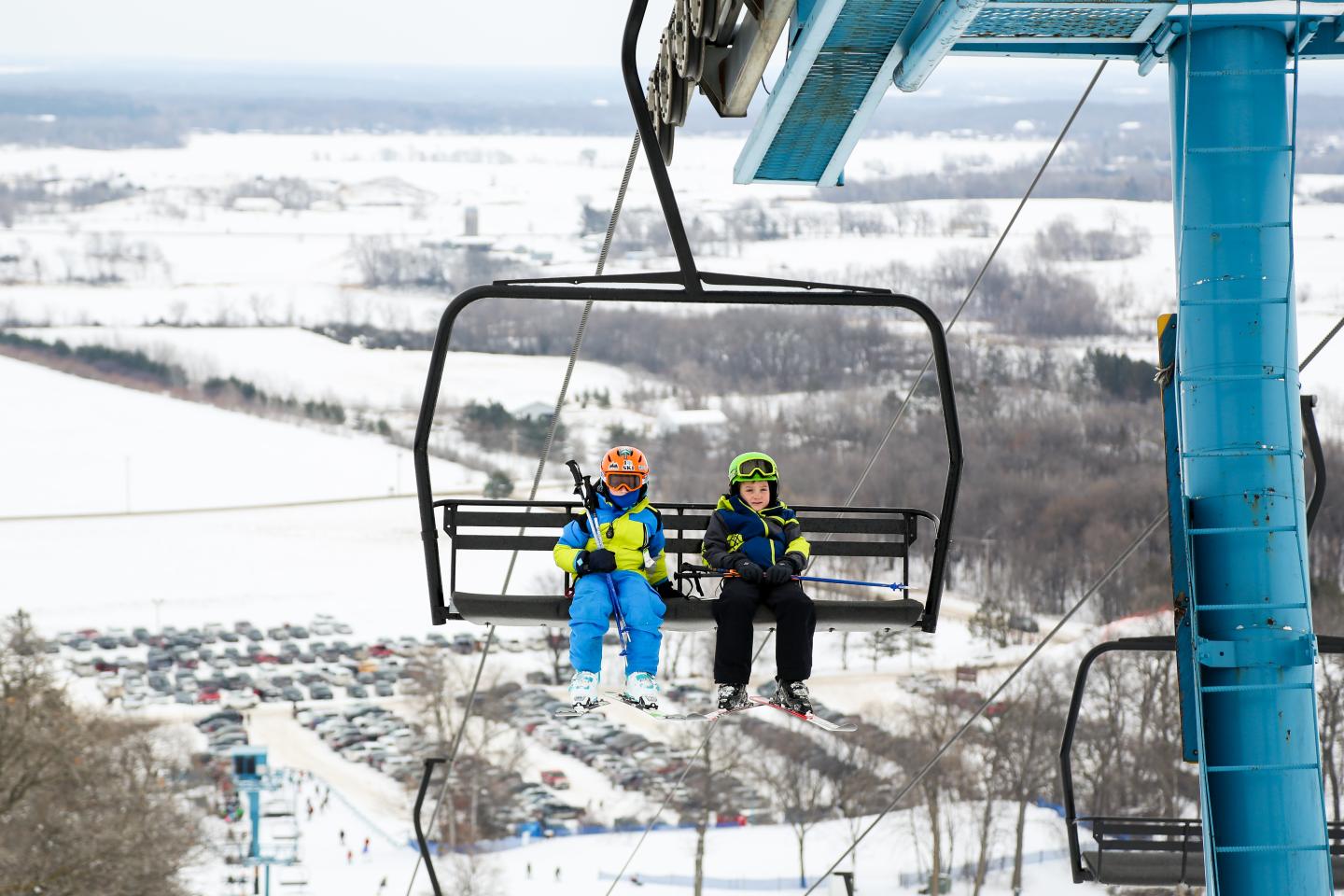 Powder Ridge in USA - a person on a ski lift in the snow.