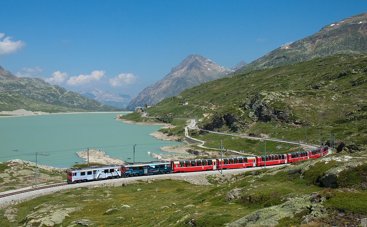Les Pléiades in Switzerland - a train traveling down the tracks in the mountains.