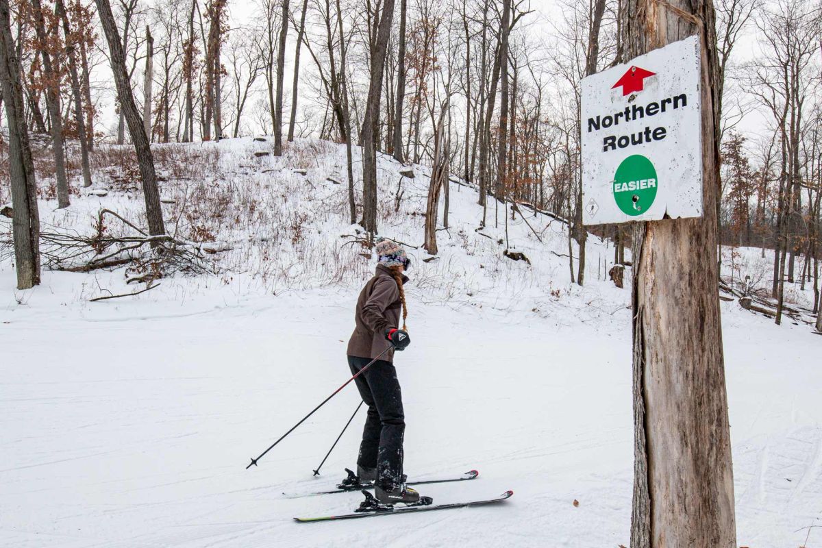 Wild Mountain in USA - a person on skis near a sign.
