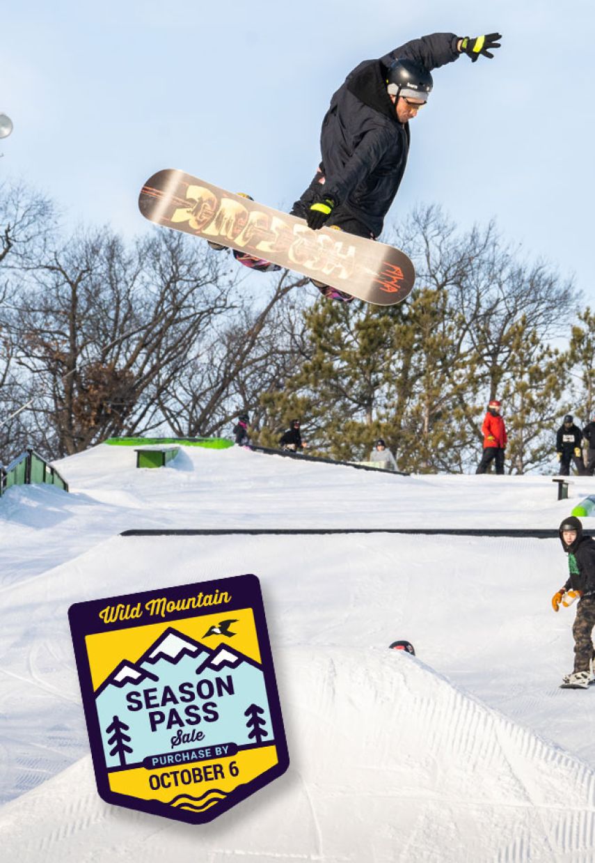 Wild Mountain in USA - a snowboarder doing a trick in the air.