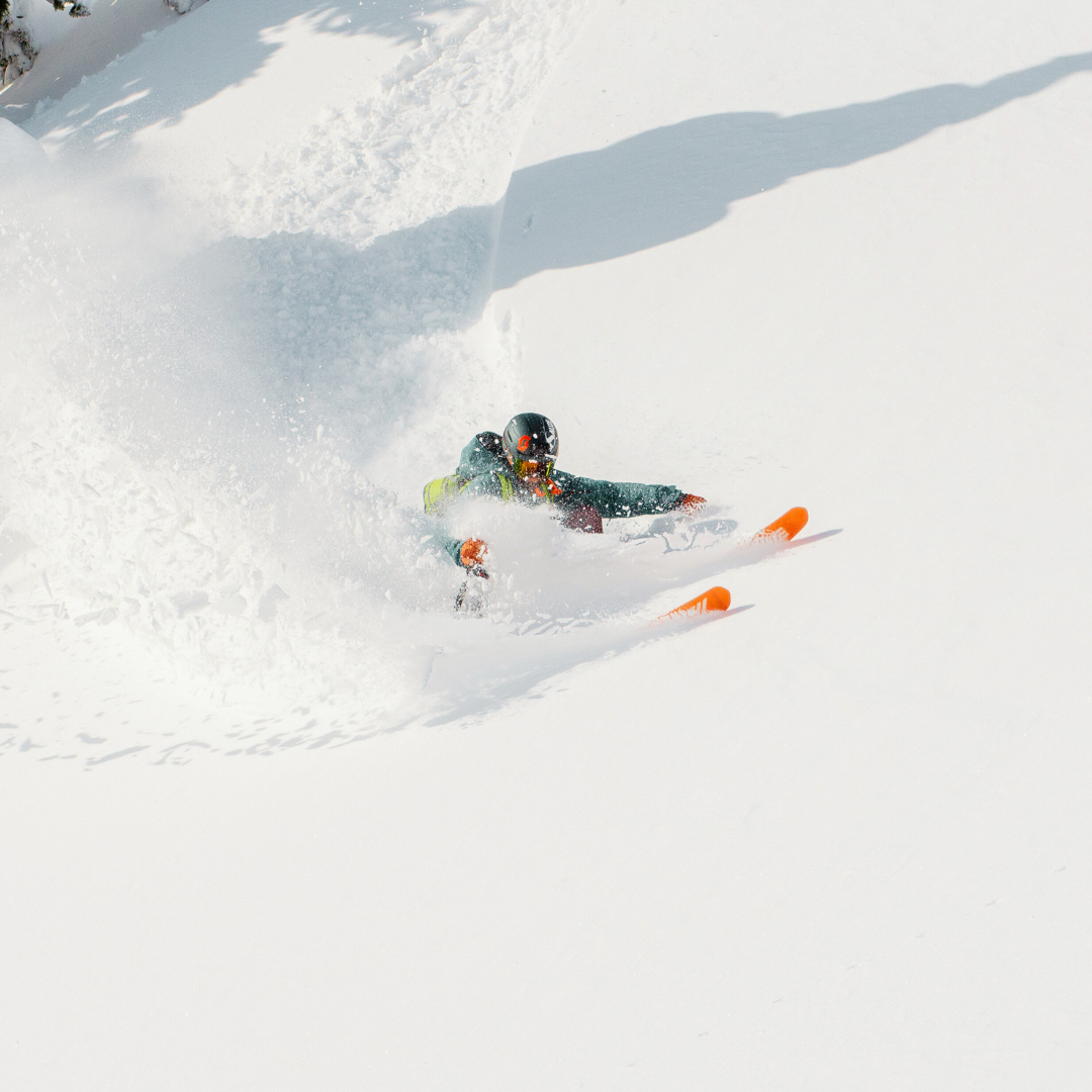 A skier making their way down the snowy slopes at Les Angles resort in Pyrénées-Orientales France. The scene showcases the excitement of winter sports.
