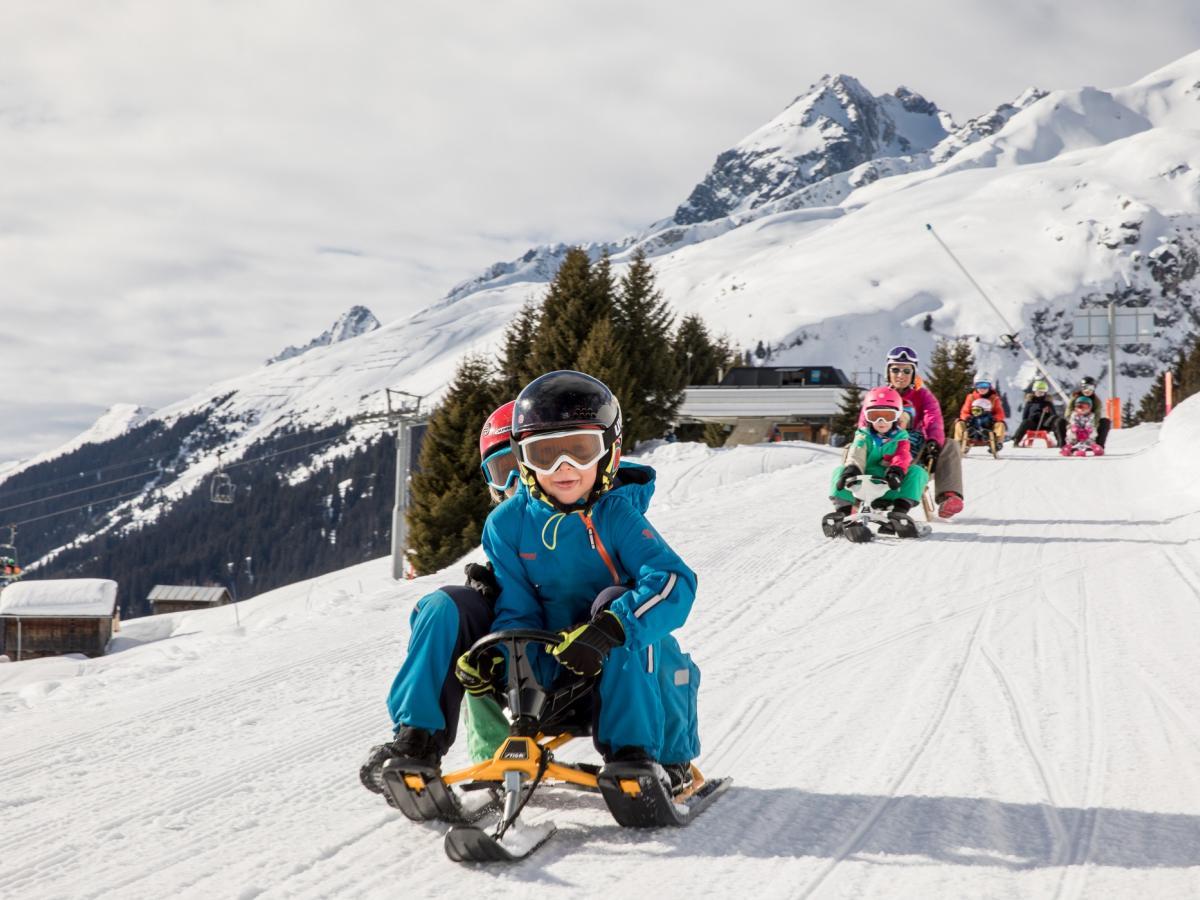 Brigels | ​Waltensburg | ​Andiast in Switzerland - a child on a snowboard.
