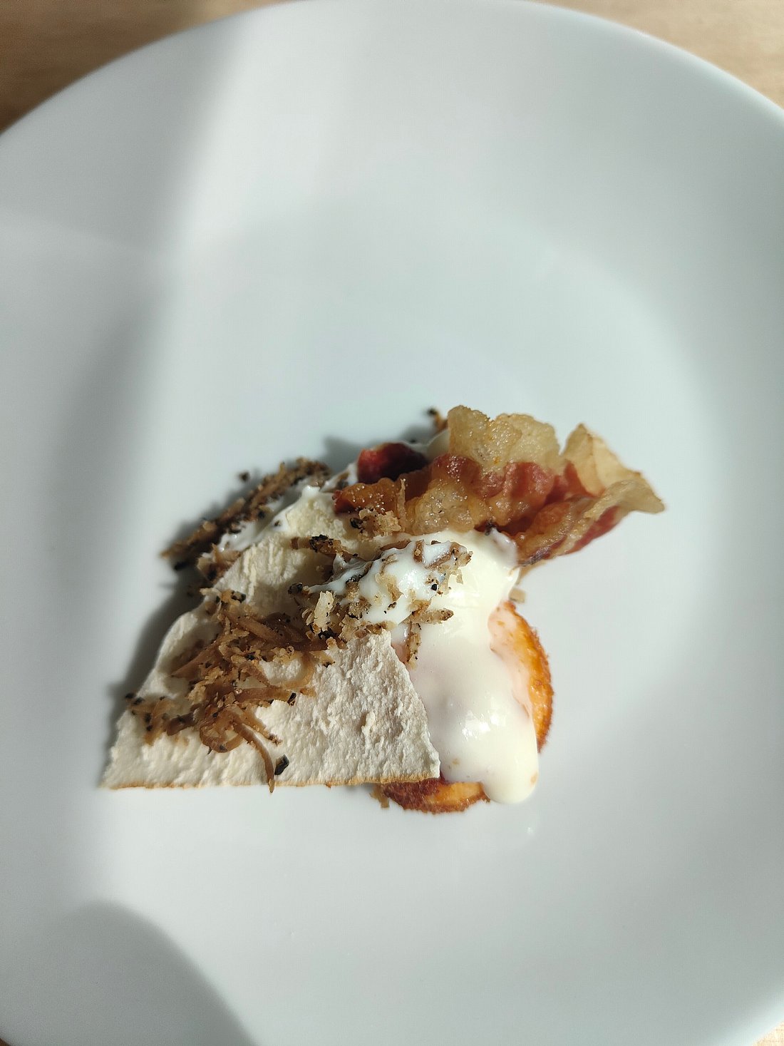 Pintura – Bolognola in Italy - a piece of food on a white plate.